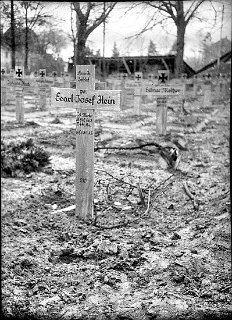An American soldier, Pvt. Earl Joseph Hein, 35842663, killed  in action February 23, 1945 and buried among German  battle casualties by the Germans.  He was a member of the 28th Infantry Regiment, 8th Infantry Division. He is now  interred in Henri-Chapelle American Cemetery, Hombourg, Belgium